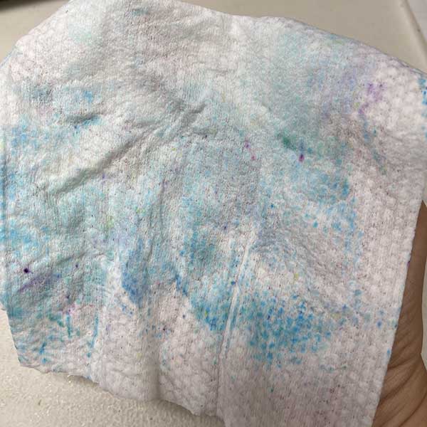 Wipe used to clean outside of tie dye bottles