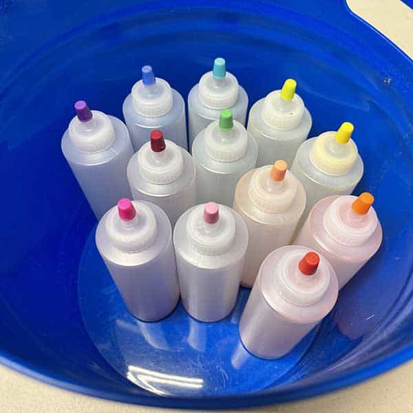Tie dye bottles in bucket